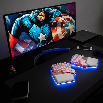 Silver Dygma Defy with white keycaps and blue and red RGB